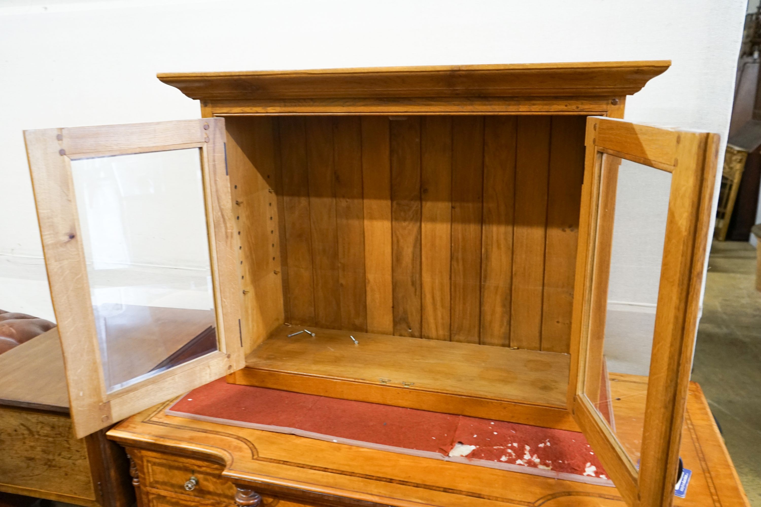 A glazed oak two door wall cabinet, width 107cm, depth 37cm, height 80cm